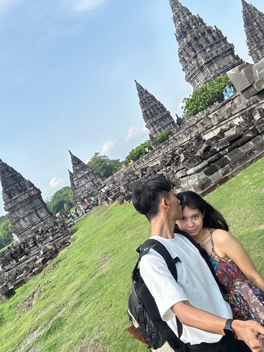 Sadu kissing Ima's cheek in front of the Prambanan temples in Jogja